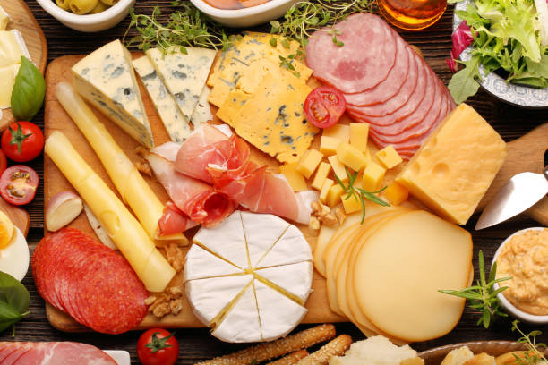 istock buffet of various types of cheese and appetizers set 637617574