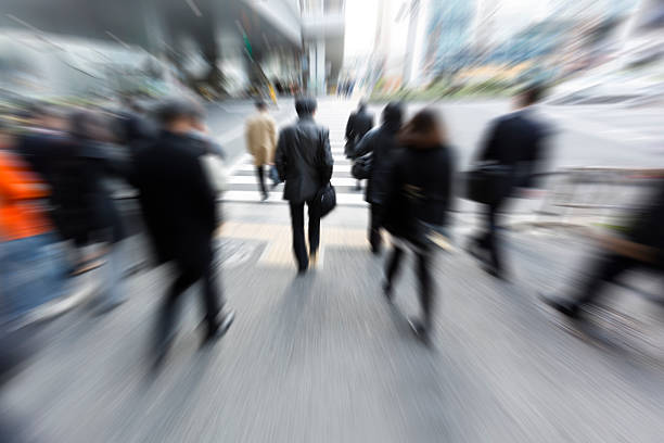 istock Crowds of Commuters Walking Through Pedestrian Walkway in the Morning 637619364