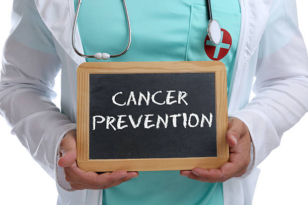 Cancer prevention screening check-up disease ill illness healthy Cancer prevention screening check-up disease ill illness healthy health young doctor with sign cancer screening stock pictures, royalty-free photos & images