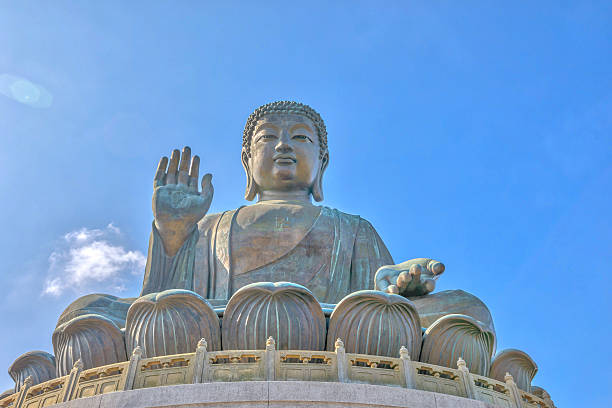 Tian Tan Buddha Lantau Tian Tan Buddha also known as Big Buddha, a large bronze statue at Ngong Ping on Lantau Island, Hong Kong, China. The sitting Buddha, icon of island, 34 meters high, draws pilgrims from all over Asia. tian tan buddha stock pictures, royalty-free photos & images