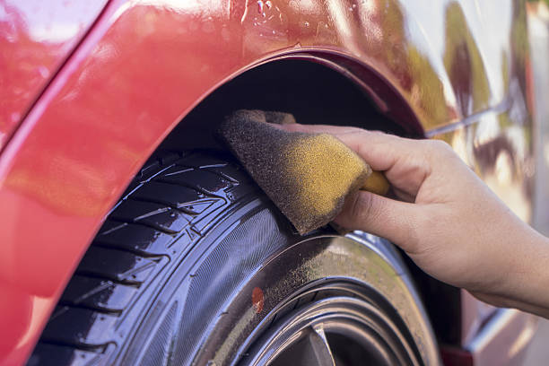 istock Washing a car with water 637621582