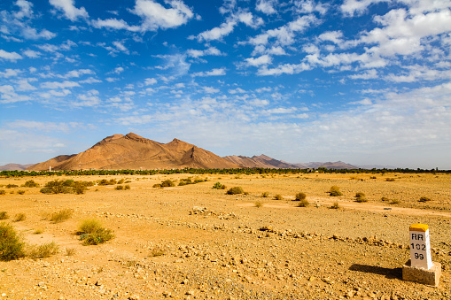 Landscape of southern Morocco is characterized by mountains, plains, stony soil, sand and meager vegetation.