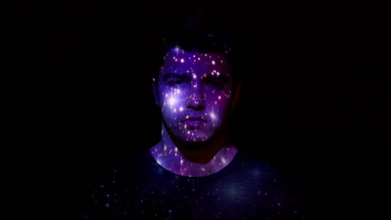 Projection of nebula and stars on a man's face