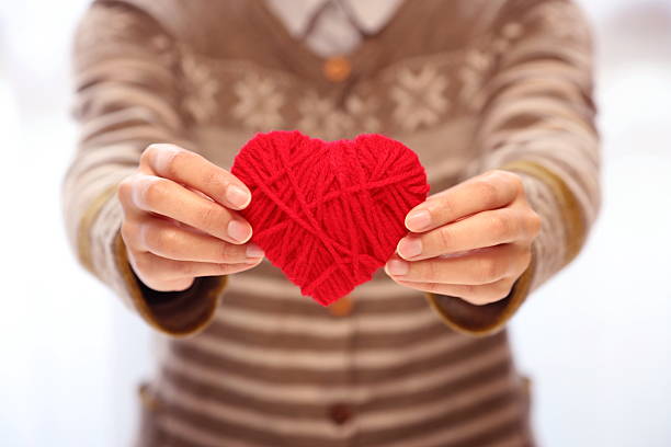 istock woman with a heart 637633120