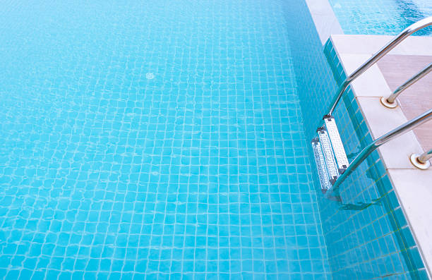 istock Luxury beautiful swimming pool at resort 637633504