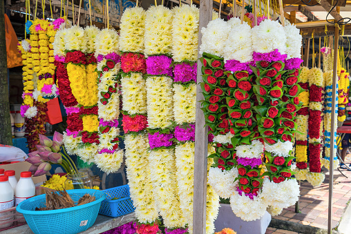 Flower stall selling garlands for temple offerings near Batu Cave, Kuala Lumpur, Malaysia