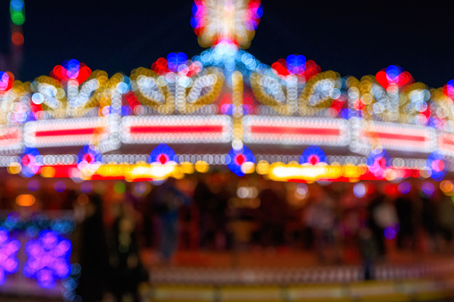 Blurred festive lights of a funfair for background use