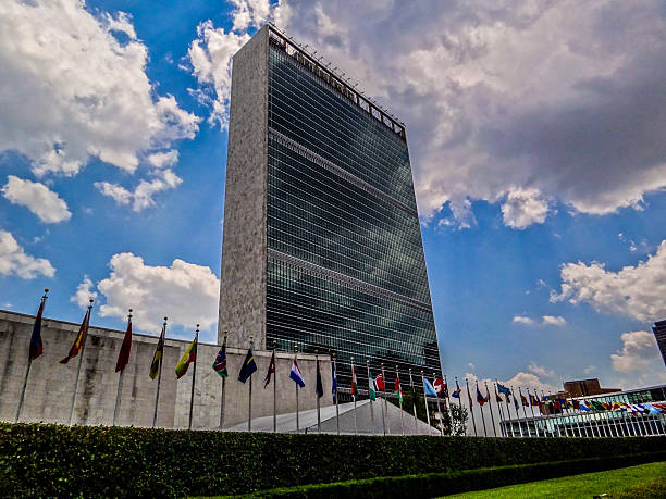 Geneva, Switzerland - December 03, 2019: Palace of Nations and Country flags - United Nations Office - Geneva, Switzerland