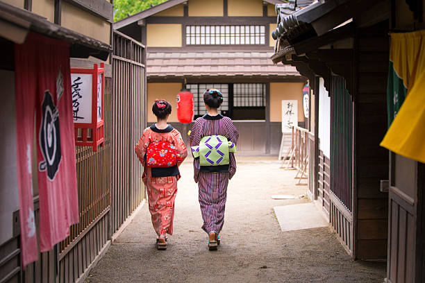 Two young Kimono women walking together in old Edo village