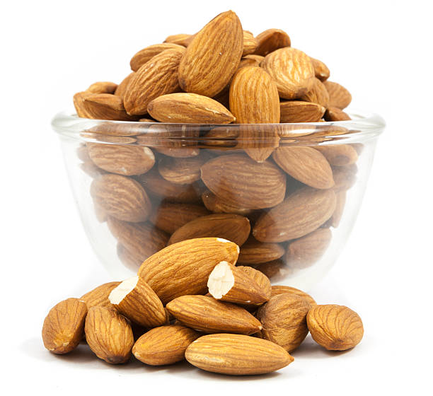 istock bowl glass of almonds isolated 637642210