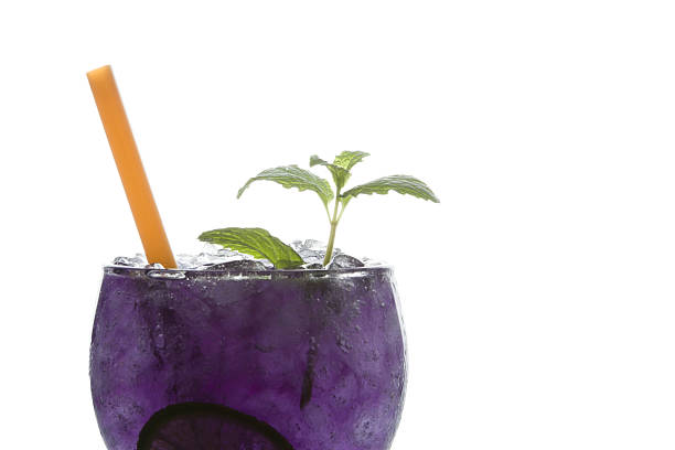 Purple soda lime drink with lime