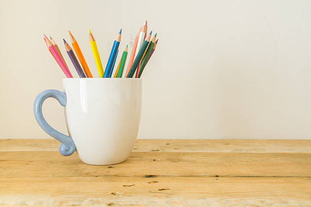 istock Color pencil in cup on wood 637645606