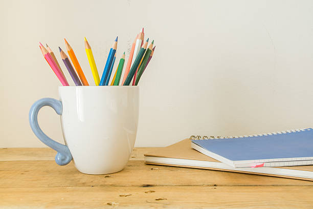 istock Color pencil in cup on wood 637645680