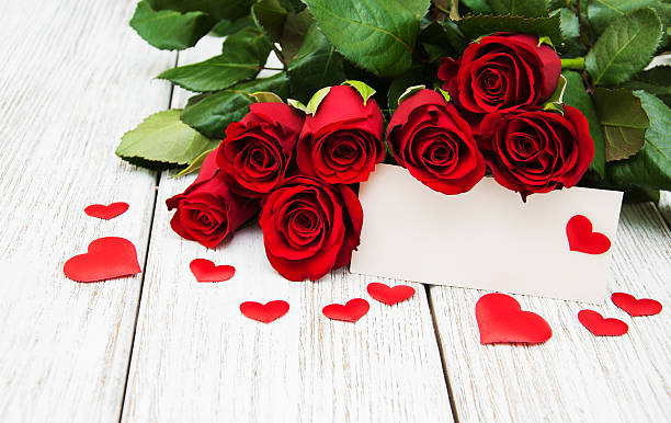 istock Red roses and greeting card 637649326