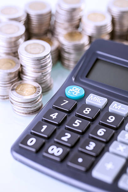 istock Couns and calculator on white background 637649542