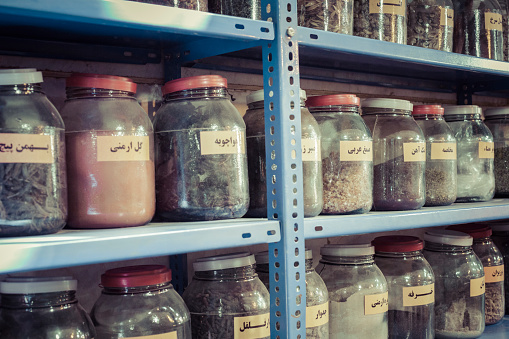 Jars of herbs and powders in a iranian spice shop.