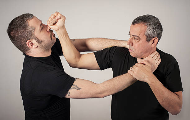 istock Street fighting self defense technique against holds and grabs 637655120
