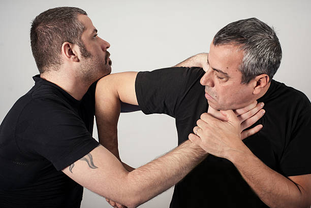 istock Street fighting self defense technique against holds and grabs 637655426