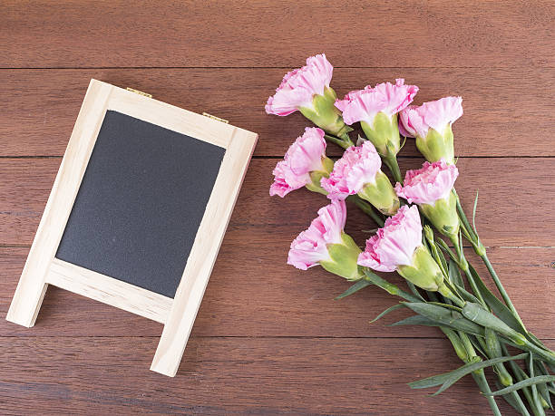 istock Black board and sweet pink Carnation flower 2 637655628