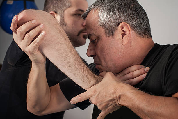 istock Street fighting self defense technique against holds and grabs 637655902