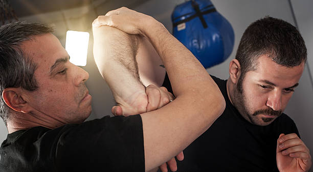 istock Street fighting self defense technique against holds and grabs 637655970