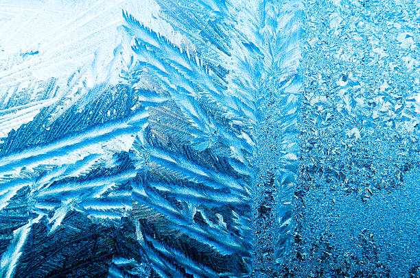 istock Beautiful frosty natural pattern on window glass 637657882