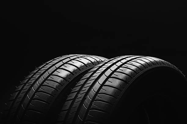 istock Summer fuel efficient car tires on black background 637659972