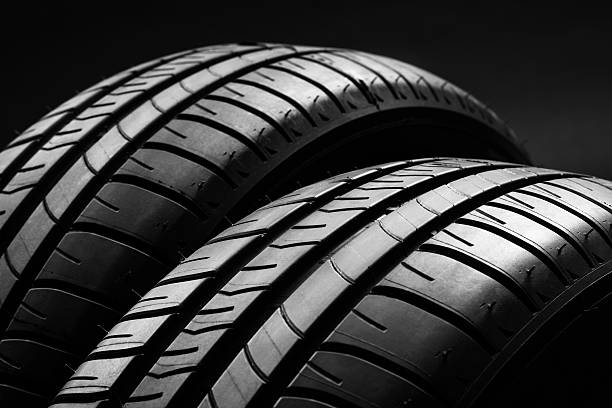 istock Summer fuel efficient car tires on black background 637660338