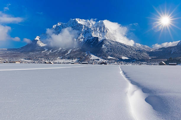 Winter wonderland in front of Mount Zugspitze Wettersteingebirge Panoramic view of beautiful winter wonderland - mountain scenery in the Alps ehrwald stock pictures, royalty-free photos & images