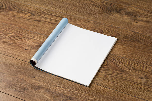 istock Mock-up magazines or catalog on wooden table background. 637664432