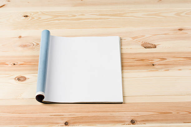 istock Mock-up magazines or catalog on wooden table background. 637664498