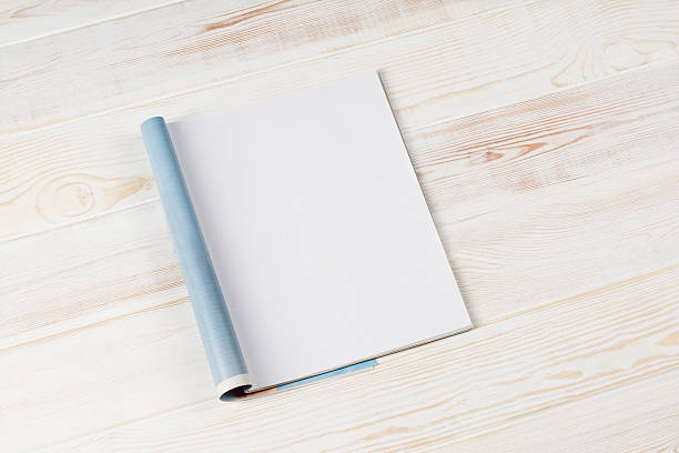 istock Mock-up magazines or catalog on wooden table background. 637664604