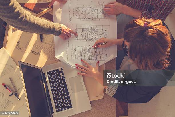 Group Of People Architects Discussing Business Plans Stock Photo - Download Image Now
