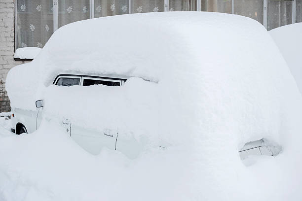 istock car parking under lot of snow 637668810