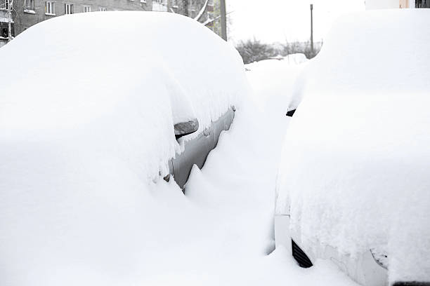istock car parking under lot of snow 637668832