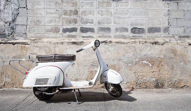istock white Classic  scooter stands parked near the 637670484