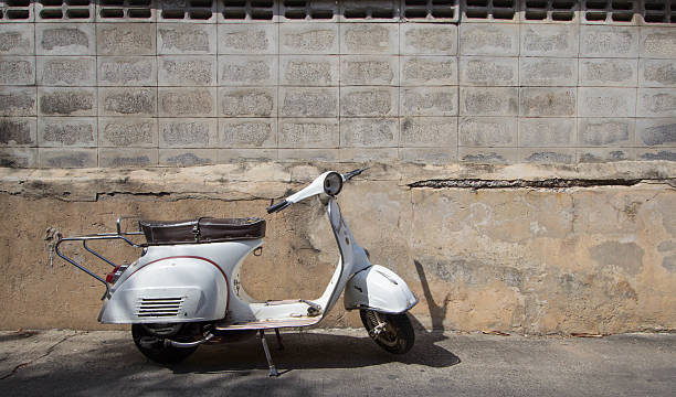 istock white Classic scooter stands parked near the 637670498