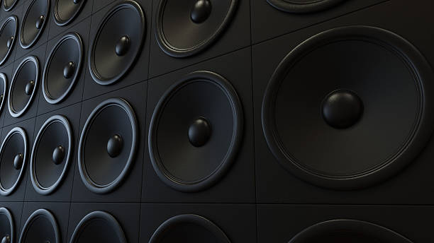 Wall of Classy Black Amplifiers Large arrangement of modern black amplifiers. This image is 3d illustration. rock n roll music speakers stock pictures, royalty-free photos & images