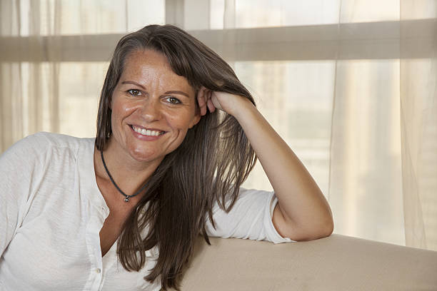 istock Smiling middle aged woman 637674052