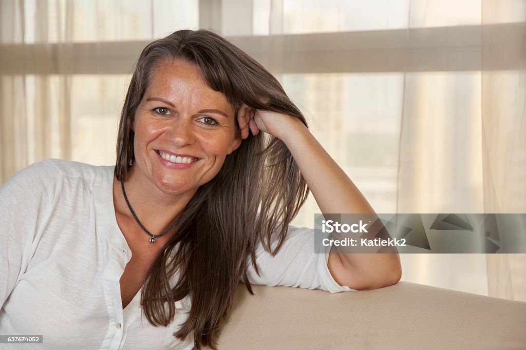 Smiling middle aged woman Portrait of a smiling middle aged woman 35-39 Years Stock Photo