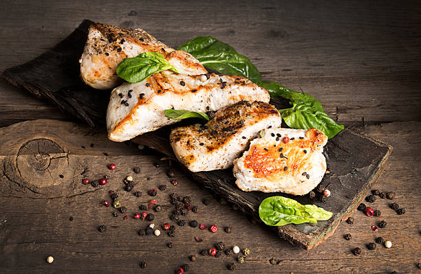 istock Grilled turkey fillet with appetizing roasted crust garnish spin 637674256