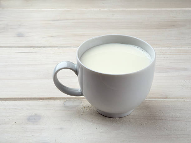 istock Cup milk white wooden board 637674388