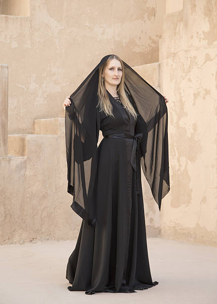 istock Woman in abaya in Jabrin castle 637674574