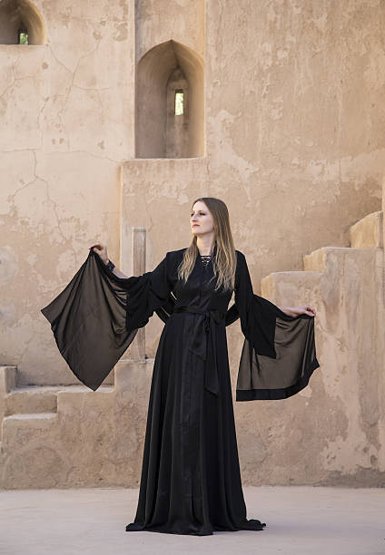 istock Woman in abaya in Jabrin castle 637674584