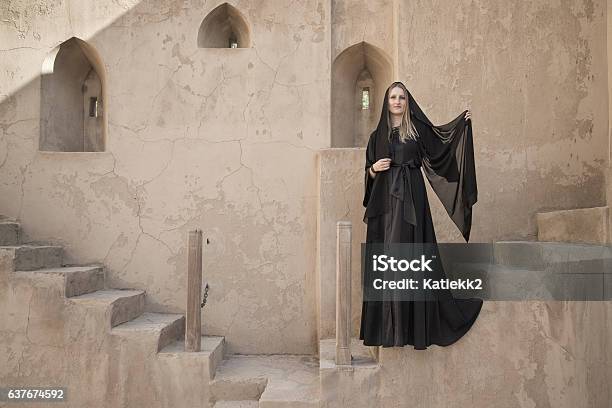 Young Woman In An Abaya In Jabrin Castle Stock Photo - Download Image Now - Abaya - Clothing, Adult, Arabian Peninsula