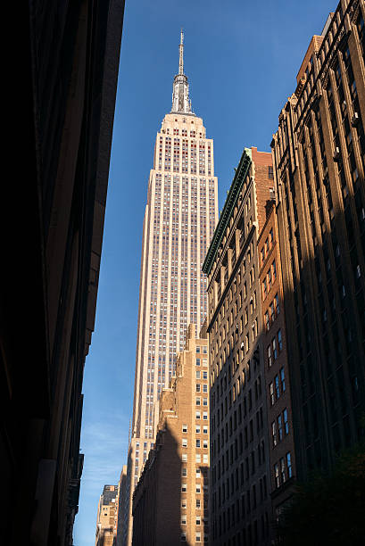 istock Looking up at the Empire State Building, New York City 637678520