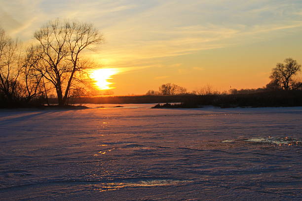 istock Sunset over the frozen river Dnieper on winter 637678778
