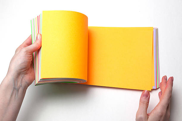 istock hand holding color paper 637680592