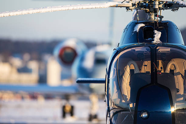 helicopter and business jet - helikopter stockfoto's en -beelden