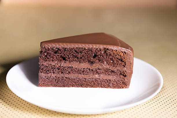 istock Delicious dark chocolate cake in white plate 637684424